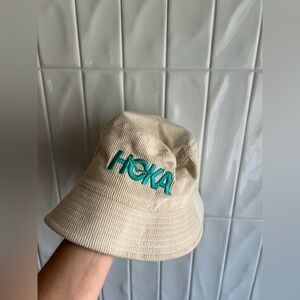Hoka Cream Bucket Hat with Orange Tag